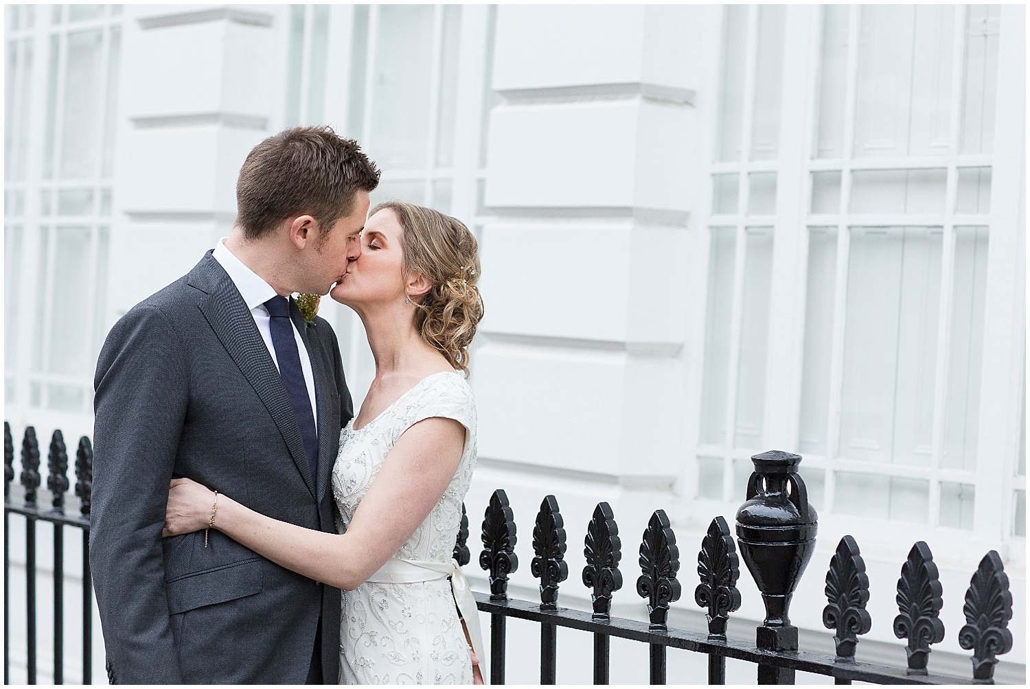 bride and groom kiss at islington town hall wedding