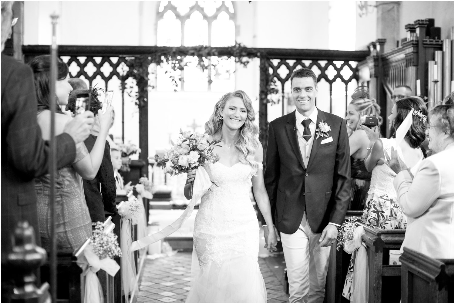 bride and groom just married at st.mary's church in stansted kent