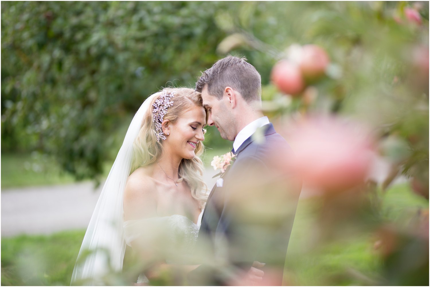 bride and groom portraits in the orchard at court lodge kent
