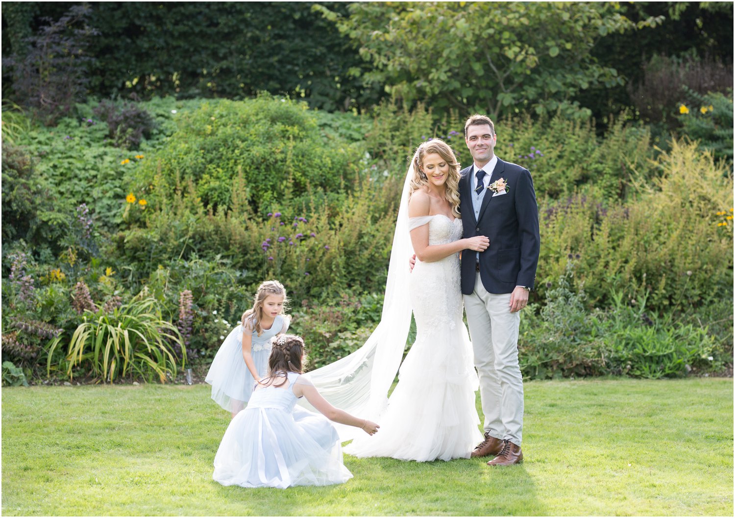 bride and groom and flower girls at court lodge in stansted kent