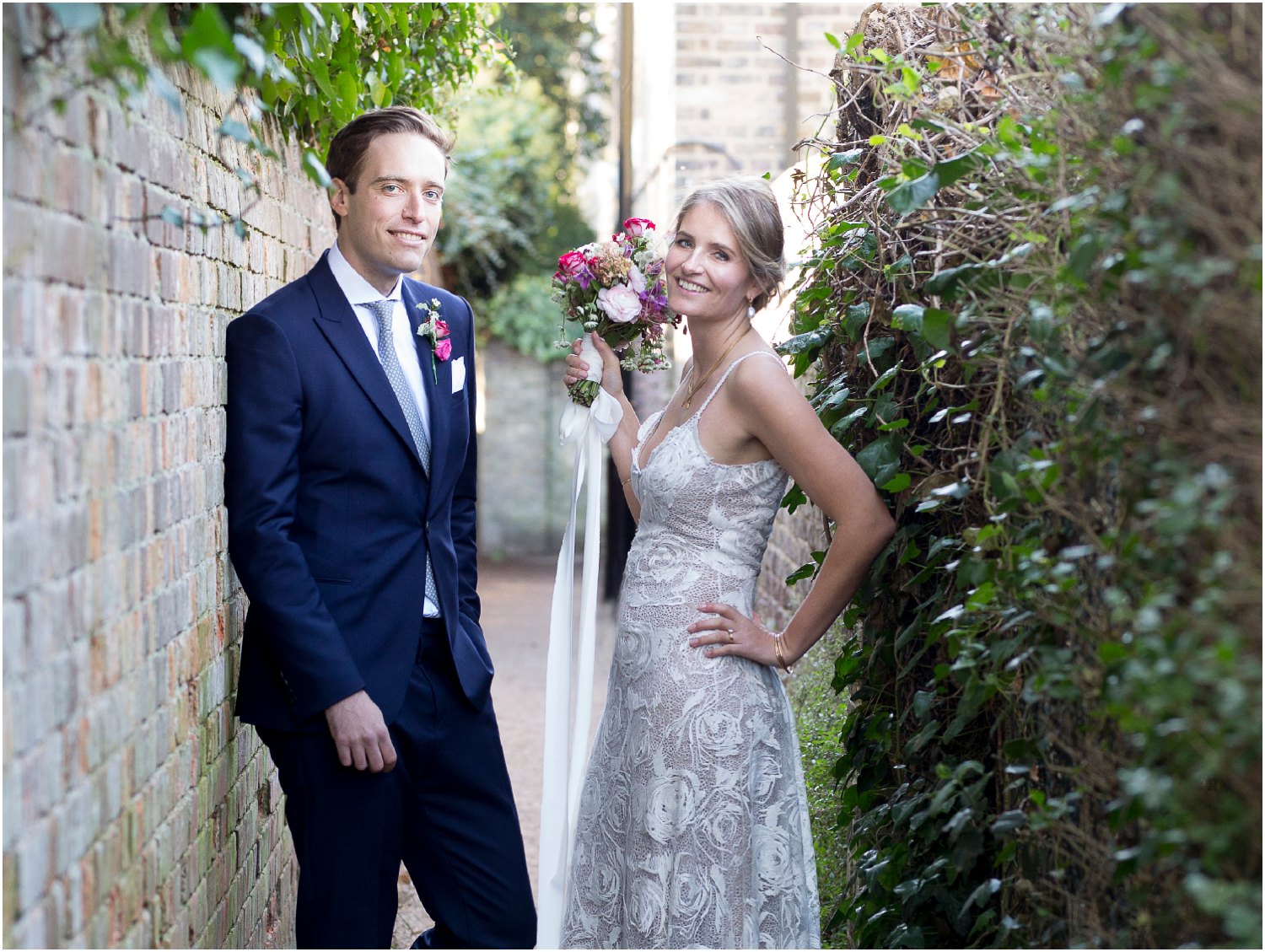 bride and groom portraits photographe in alley way at Petersham Nurseries in Richmond